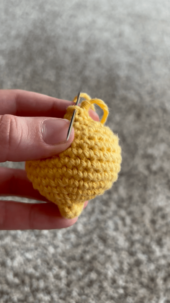 sewing the lemon keychain closed