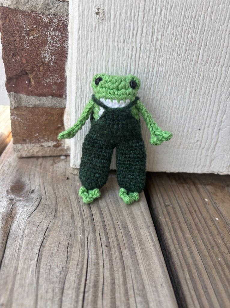 crochet long legged frog in overalls amigurumi standing
